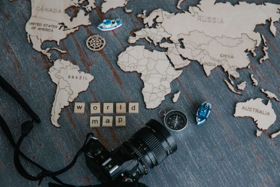 Sleek, modern compass rests on a world map, symbolizing the strategic choice between global SEO and local GEO marketing.