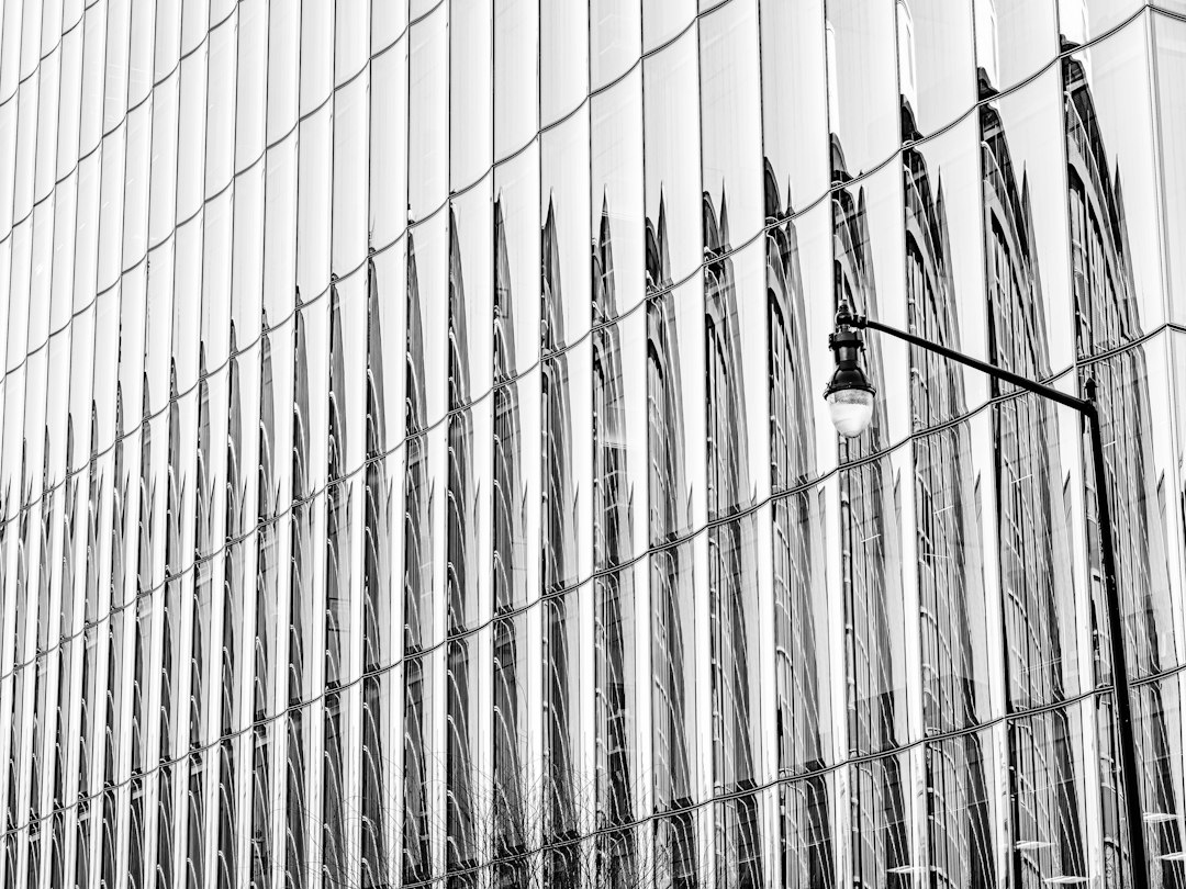 The geometric, abstract pattern of a modern building's facade, representing the complex and scalable structure of a real estate marketplace's technical SEO.